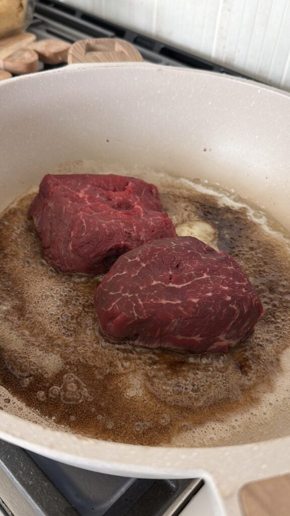 Steaks cooking in the pan
