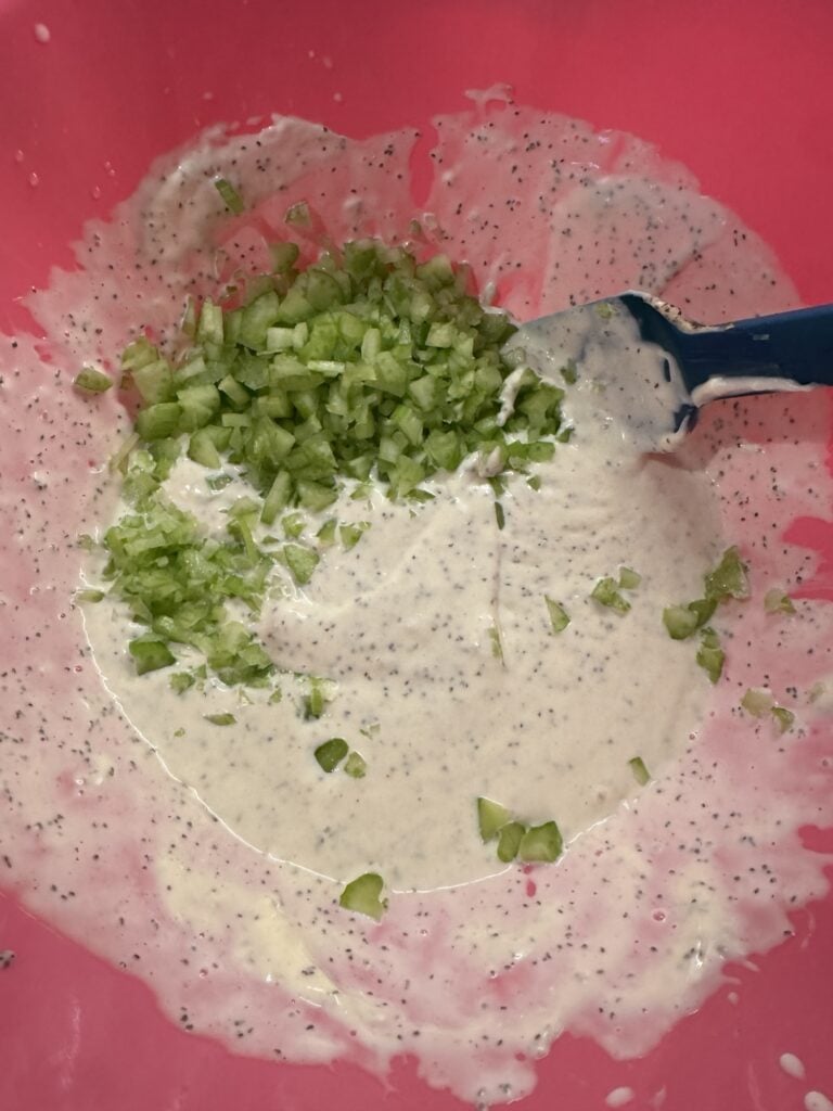Chopped celery in the dressing mix