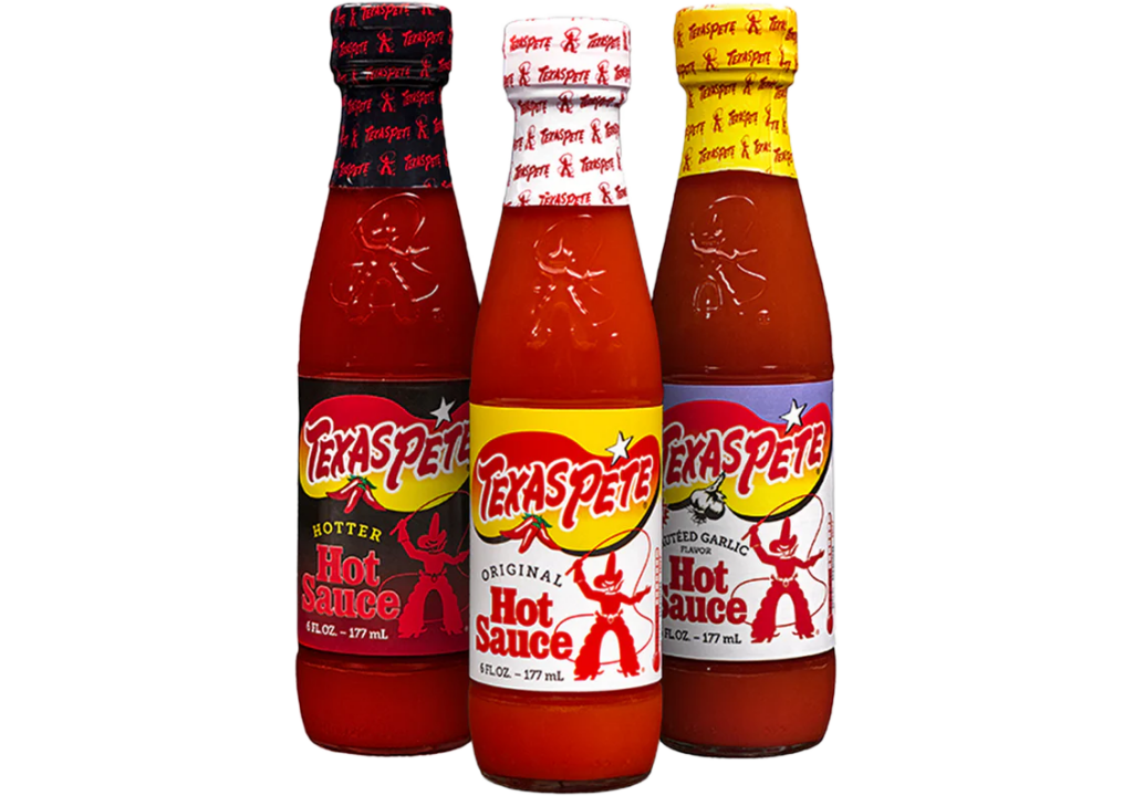 Three different bottles of Texas Pete hot sauce