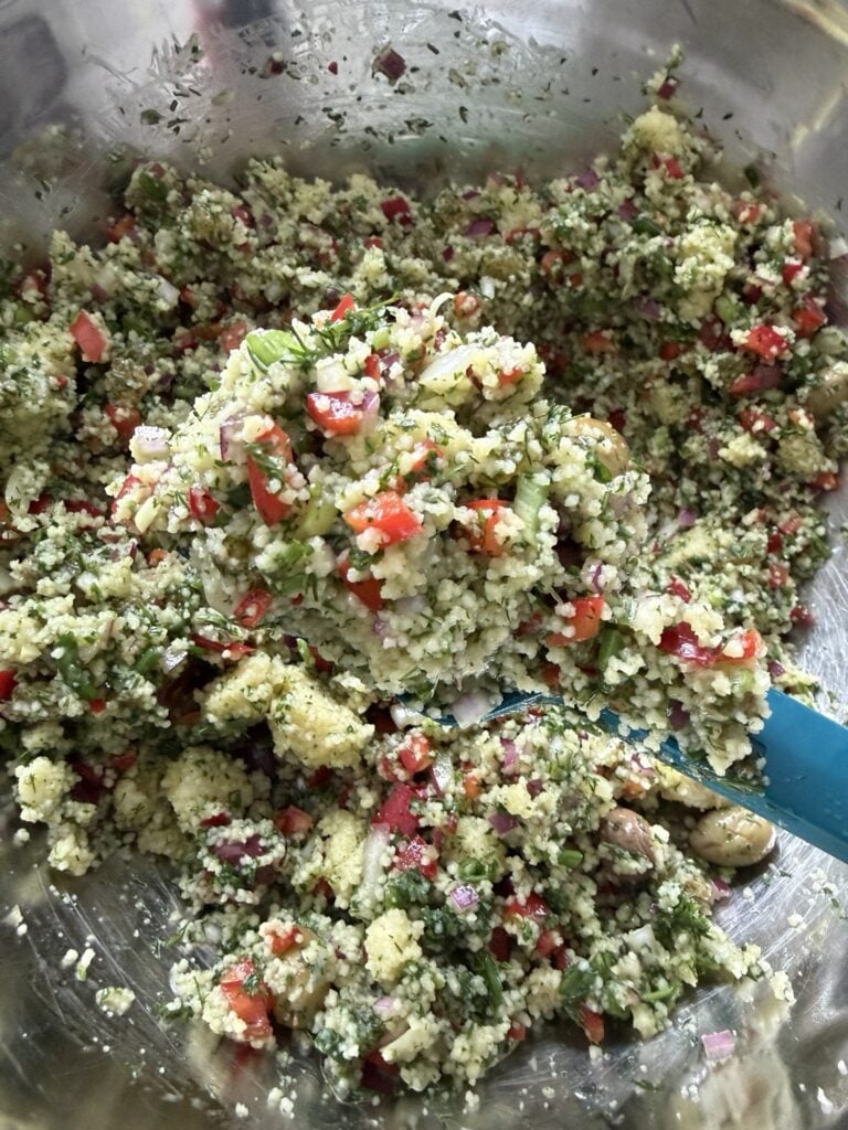 The couscous in a metal bowl