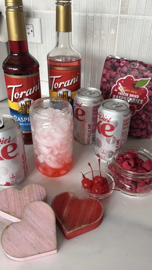 A cup of ice surrounded by the necessary ingredients