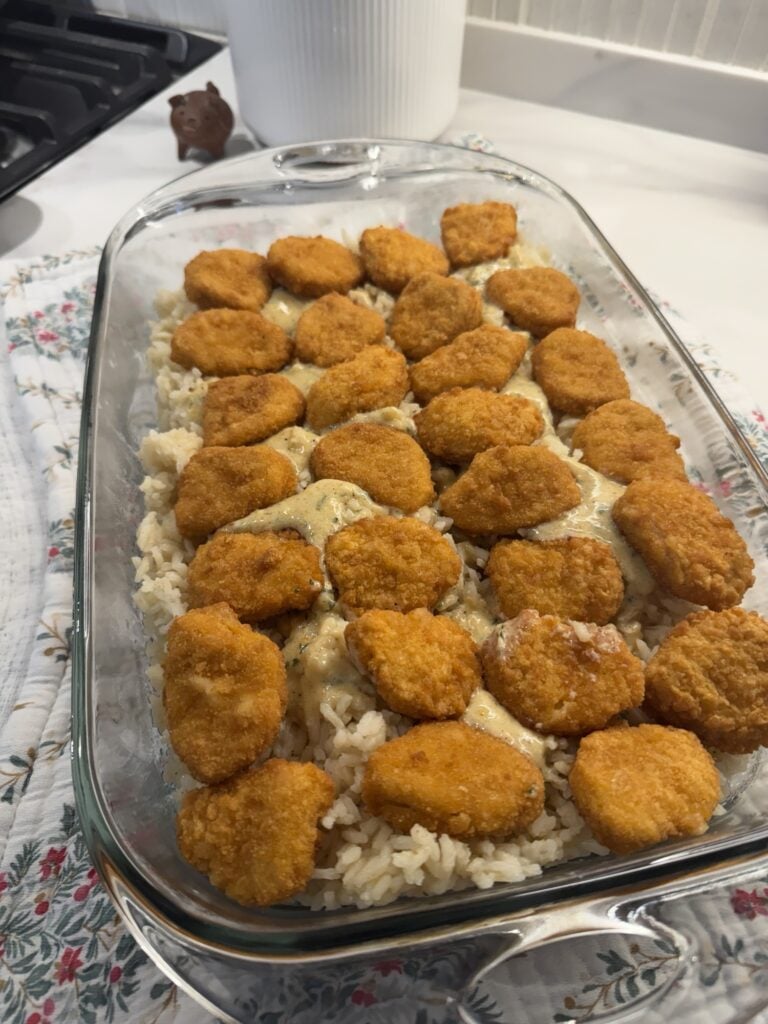 Chicken nuggets layered over the casserole base