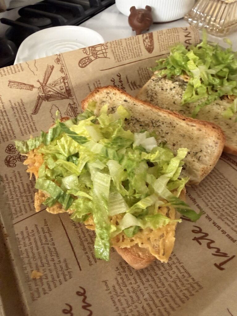 Shredded lettuce on a sub