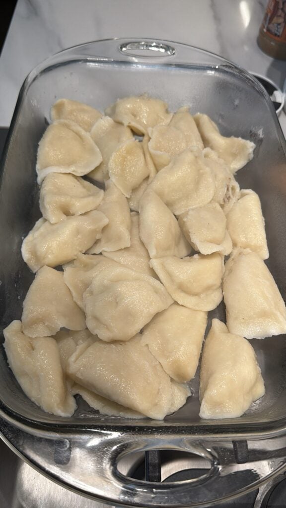 Pierogis in a glass baking dish