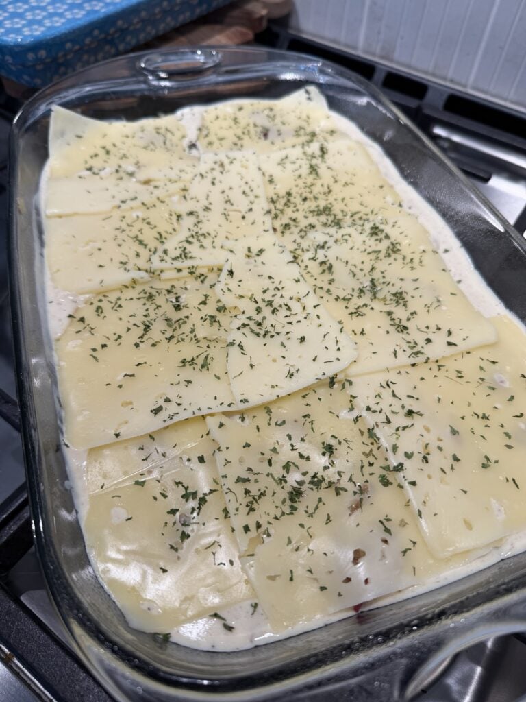 Sliced cheese over the casserole before baking