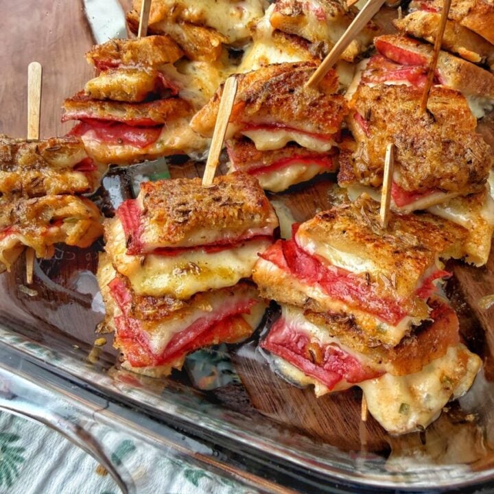 Rueben Bites with Dijon Caraway Butter, each with a small wooden skewer sticking out