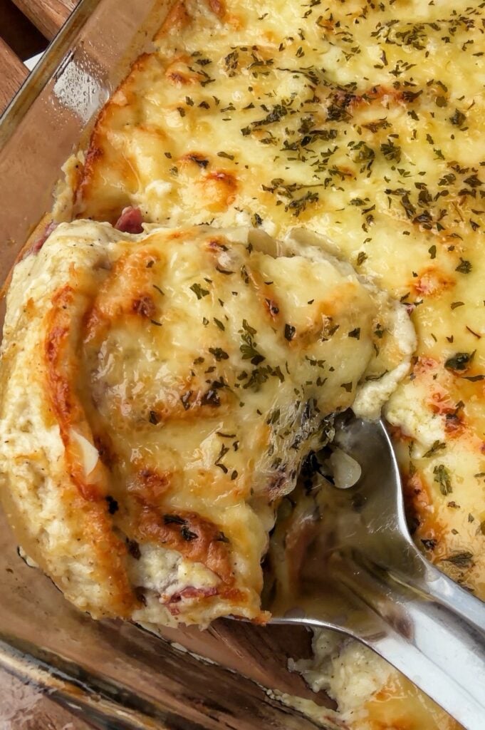 A scoop being taken out of the finished bake