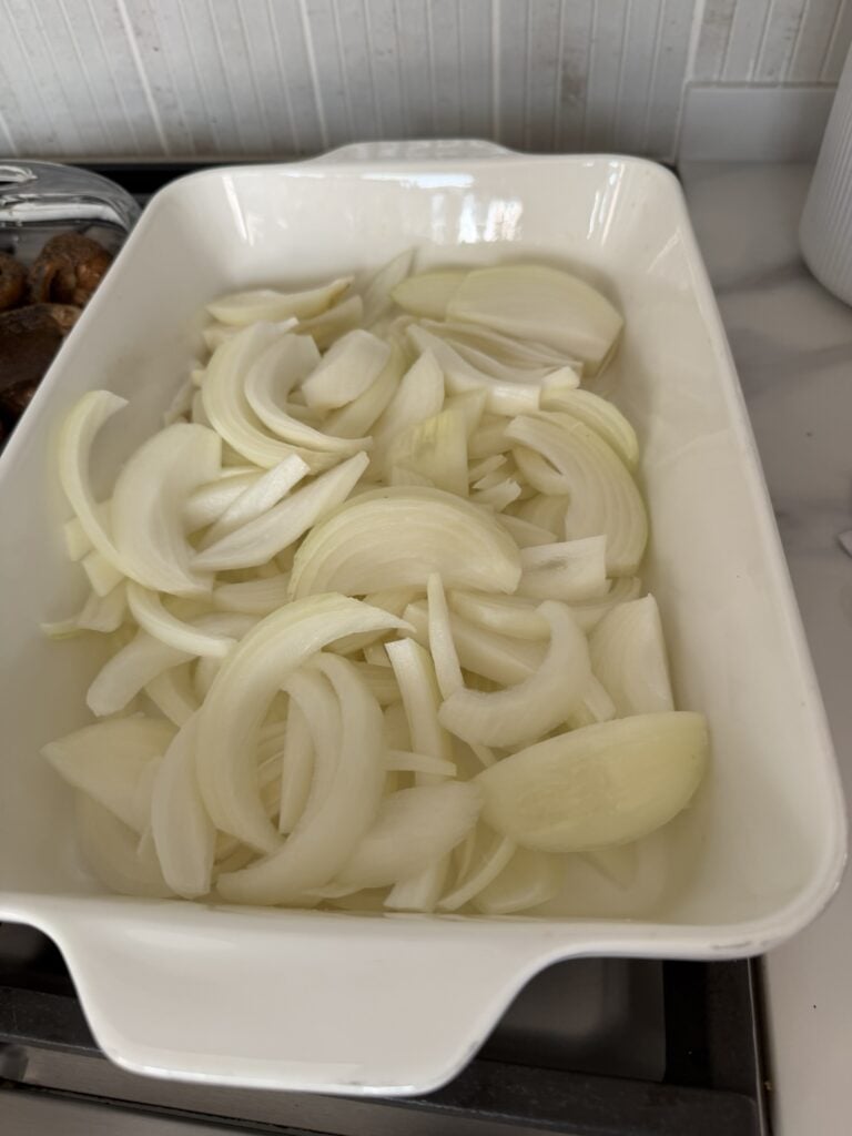 Sliced onion in a baking dish