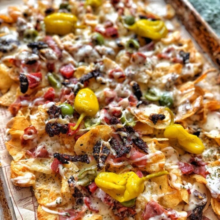 Charcuterie-Style Baked Nachos with Creamy Sun-Dried Tomato Cheese Sauce