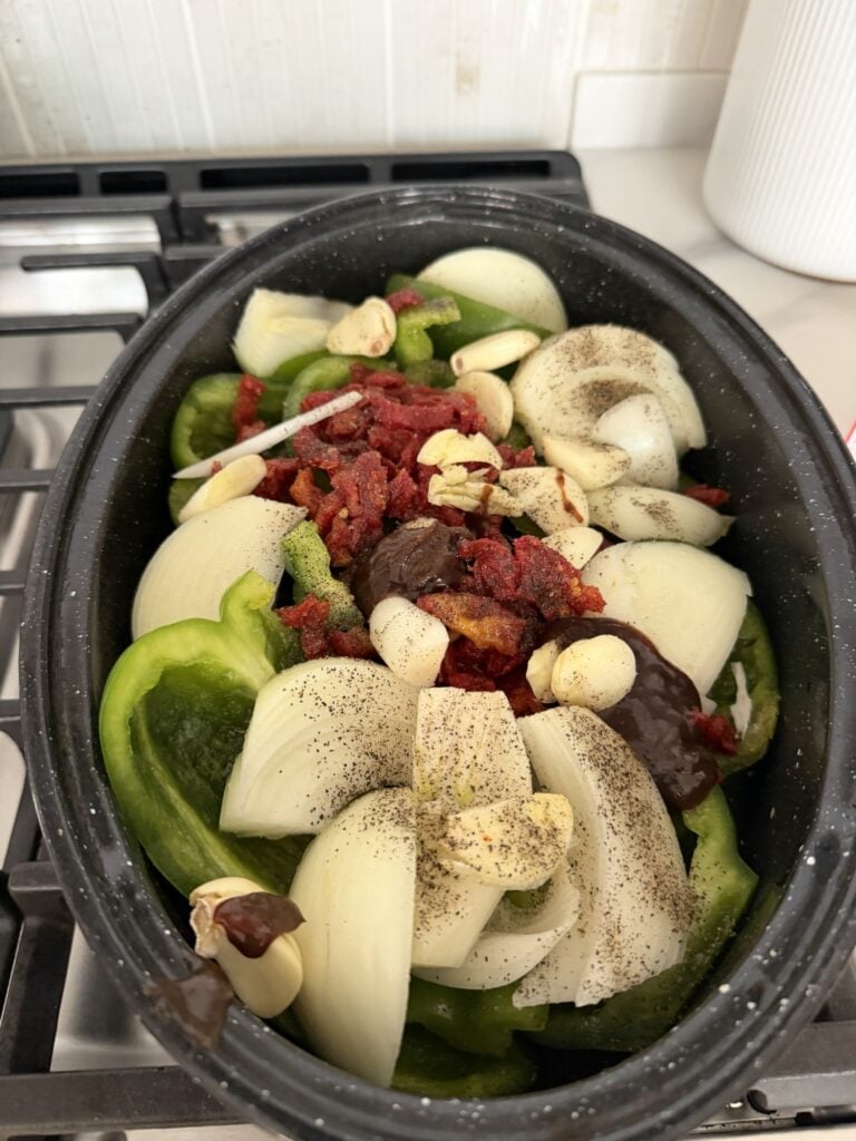 All of the makings for the au jus in the crockpot before cooking