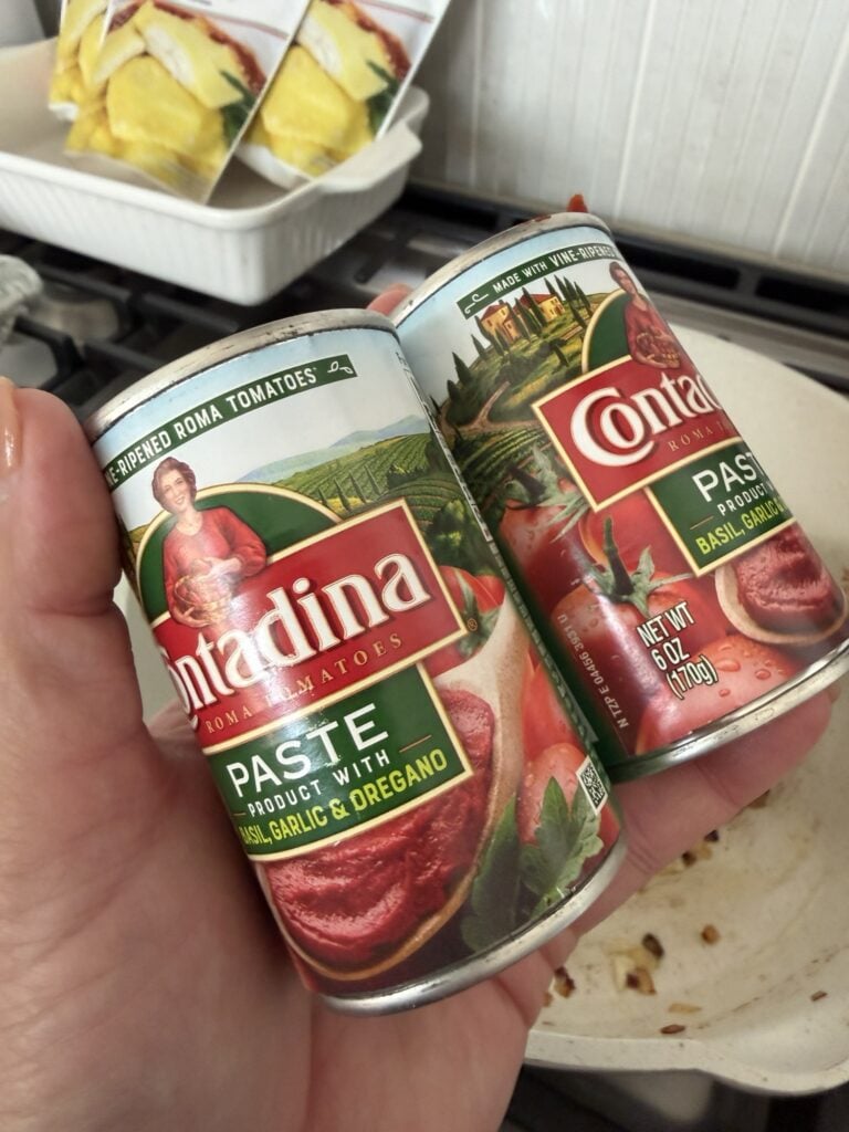 Two cans of tomato paste