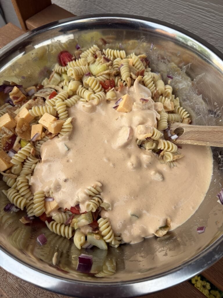 Dressing over pasta salad