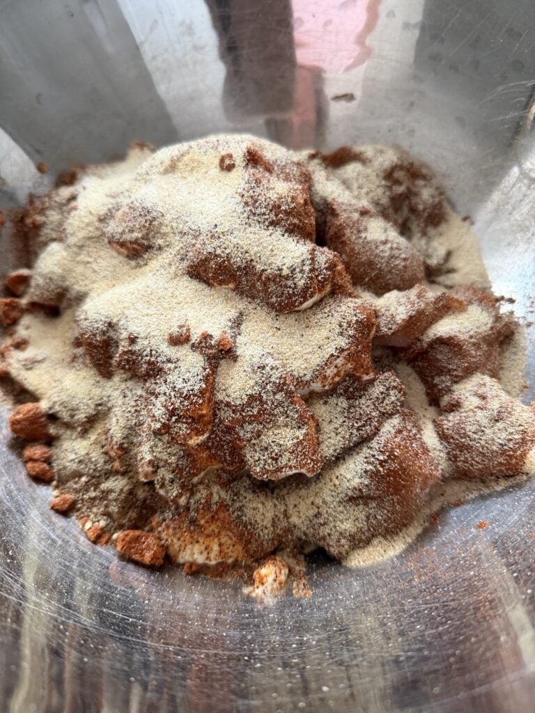 The pieces of chicken coated in spices