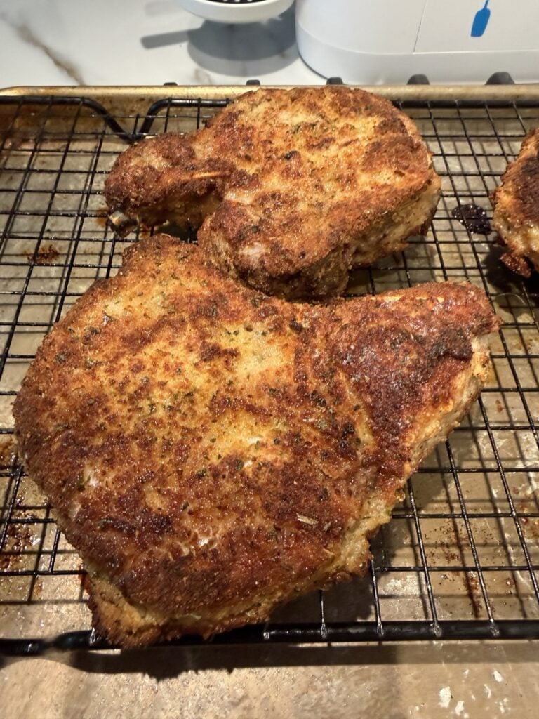 The finished chops on a rack before being topped with gravy