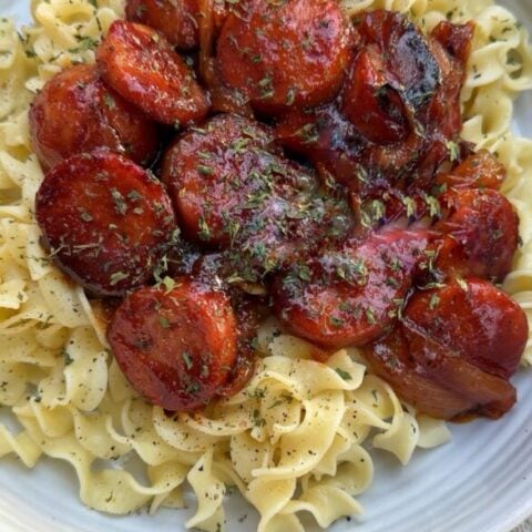Garlic & Brown Sugar Skillet Sausage and Onions Over Buttered Egg Noodles Recipe