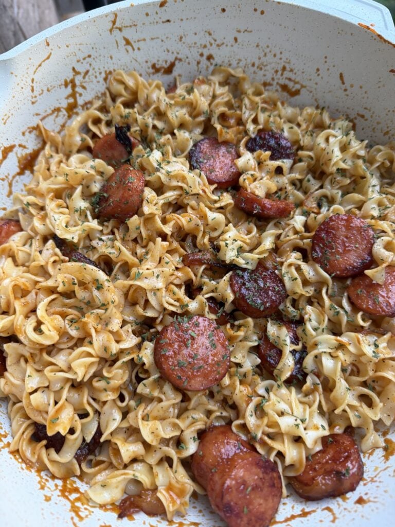 A close up of the finished dish over noodles