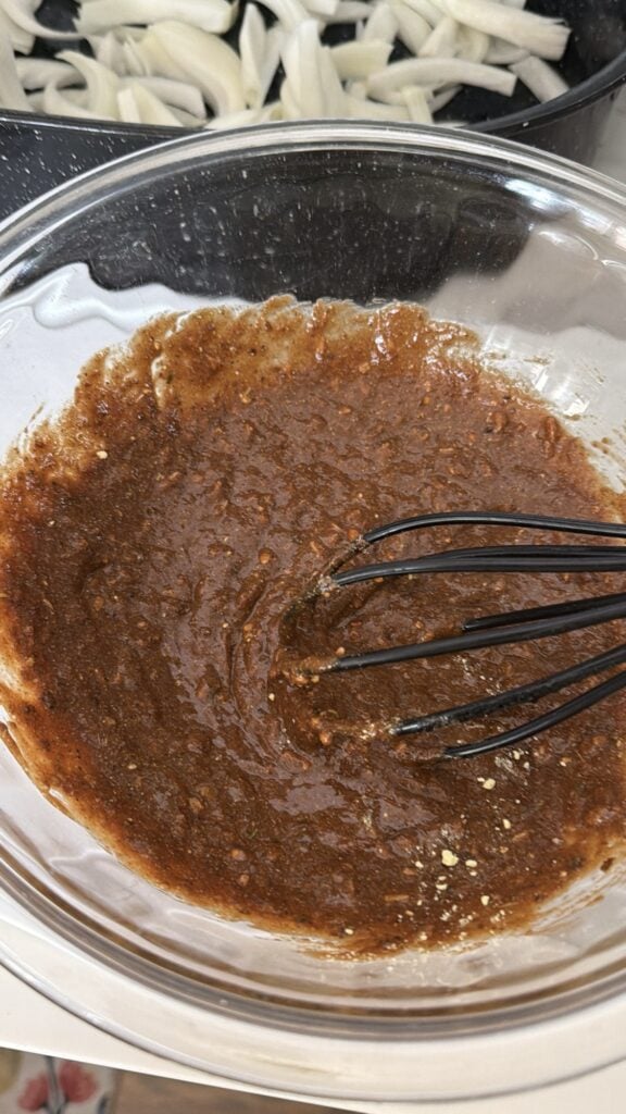The sauce being whisked
