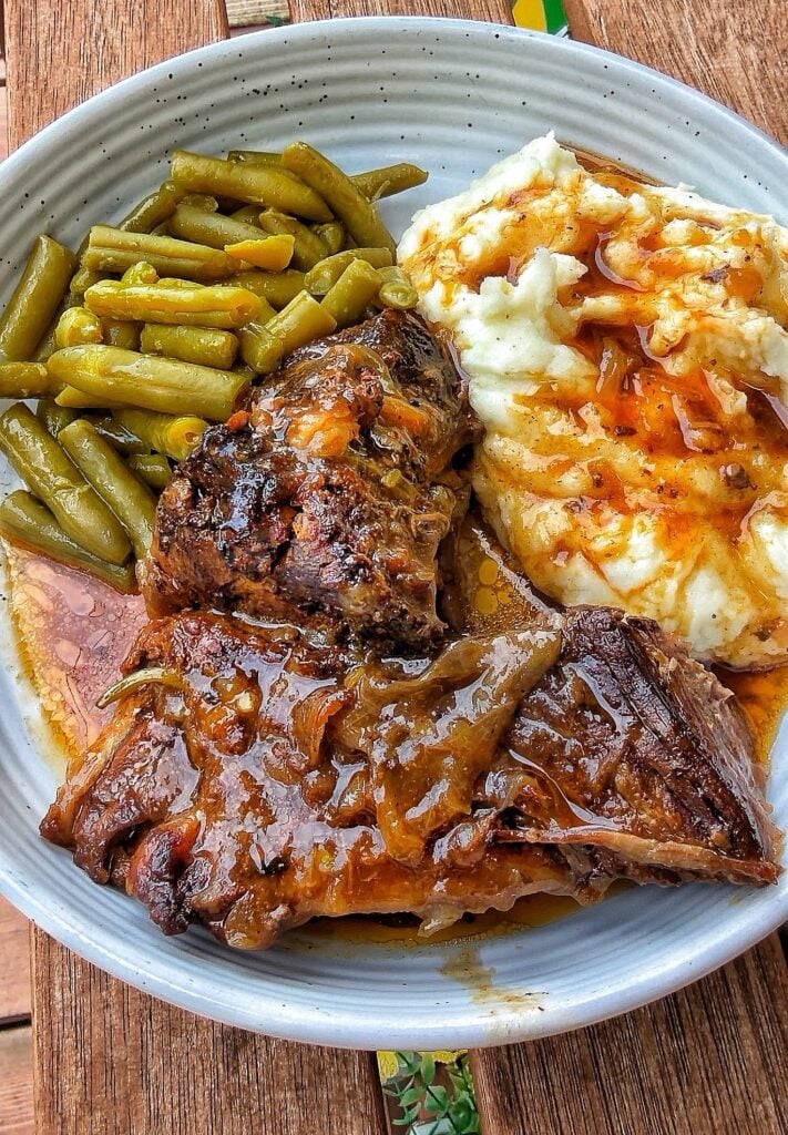 The finished roast with green beans and mashed potatoes