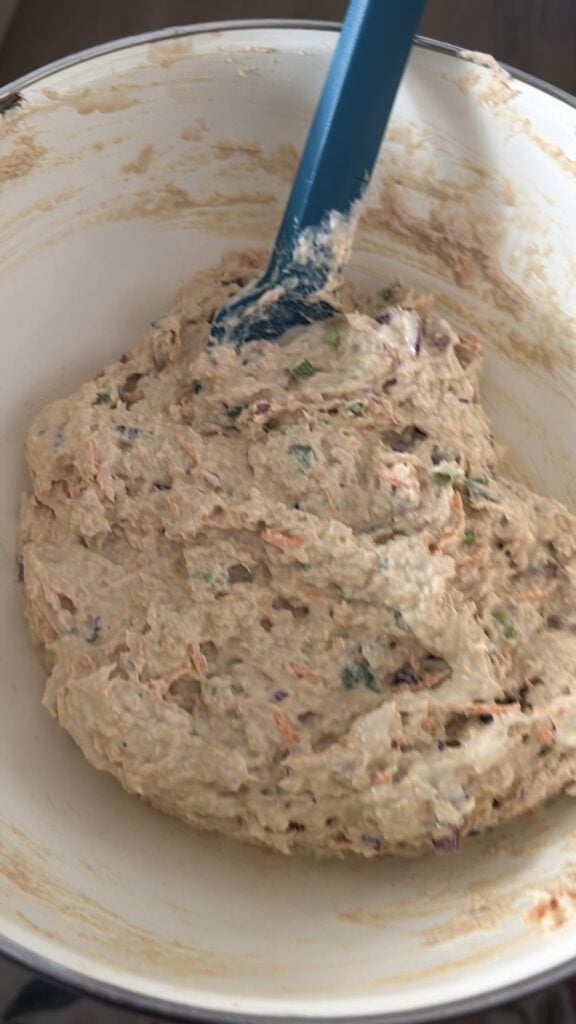 The chicken salad being mixed together