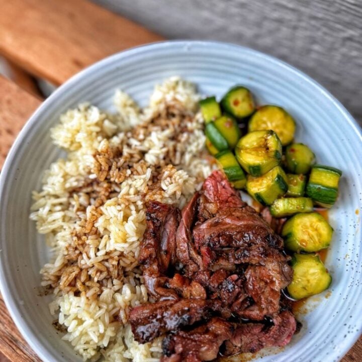 Black Pepper Skirt Steak with Garlic Soy Pan Sauce with rice and cucumber salad