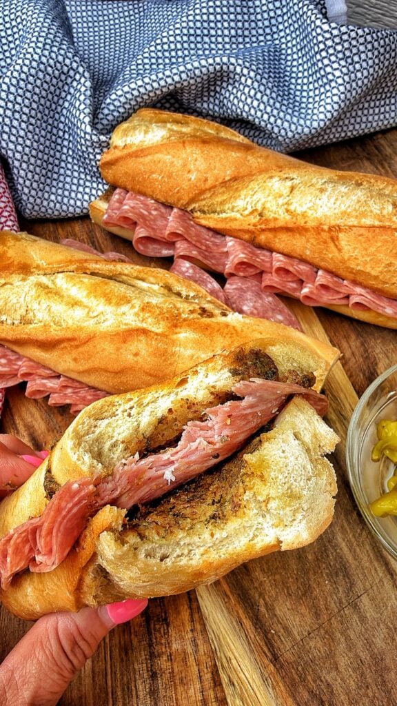 A close up of the finished sandwich with a bite taken out of it
