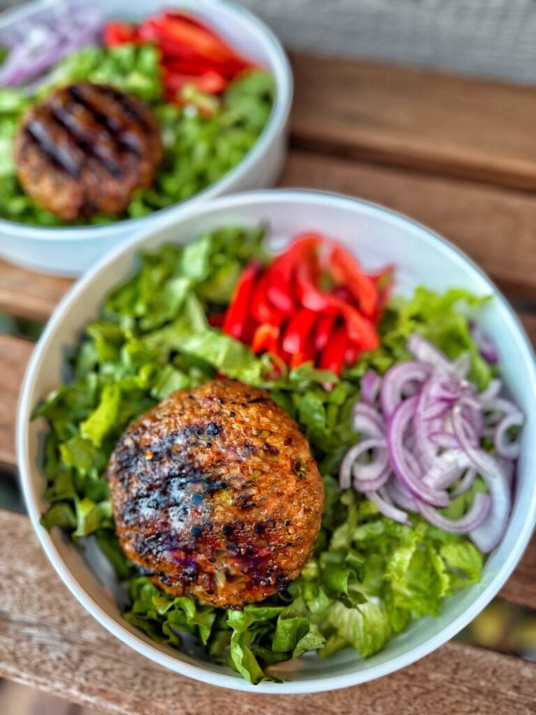 The patty on top of a salad