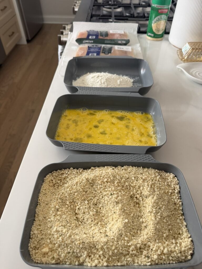 Three bowls divided into breading, egg wash, and flour