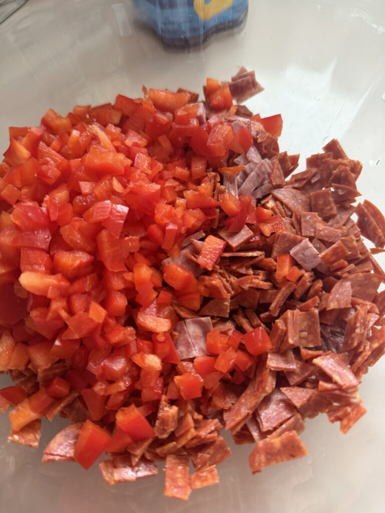 Diced up meats mixed with diced up peppers