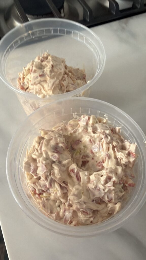 The dip portioned into plastic containers