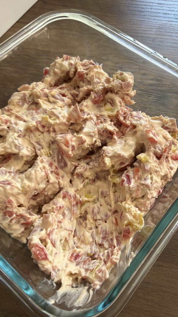 The finished dip in a Tupperware
