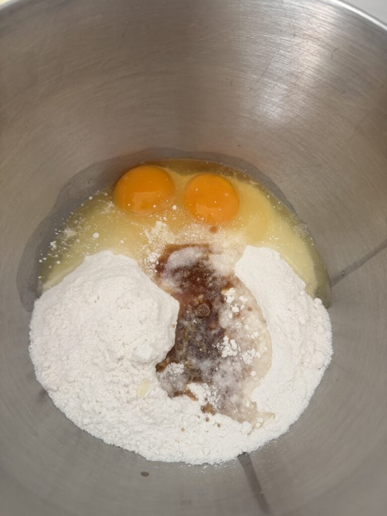 Eggs and cake mix in a metal bowl