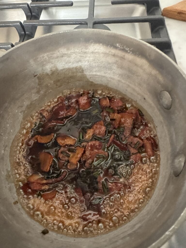 Maple soy glaze simmering for Chili Bacon Crunch Cream Cheese Spread 
