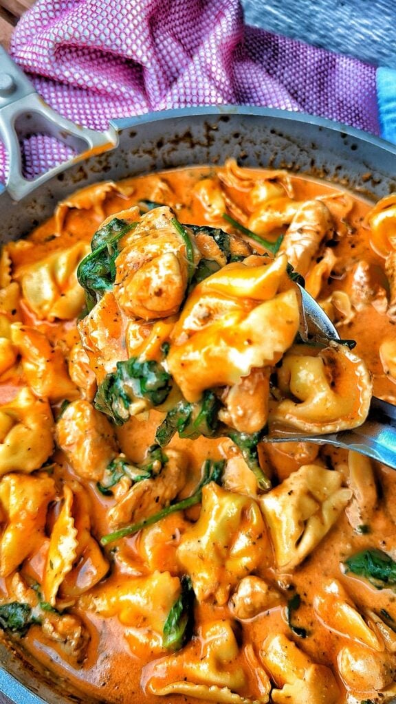 Creamy chicken and tortellini skillet with spinach and Boursin cheese sauce