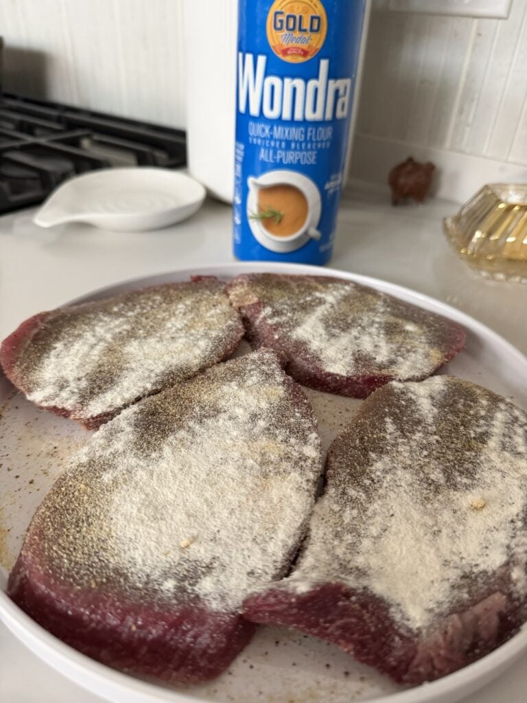 Seasoned round steaks lightly dredged in flour before browning