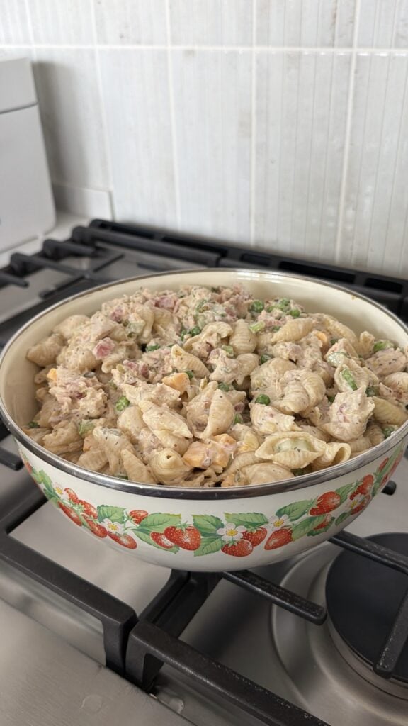 Tuna noodle pasta salad with shell pasta and peas before chilling overnight