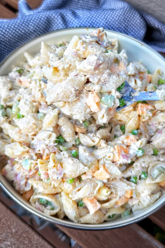 A spoon of the finished pasta salad