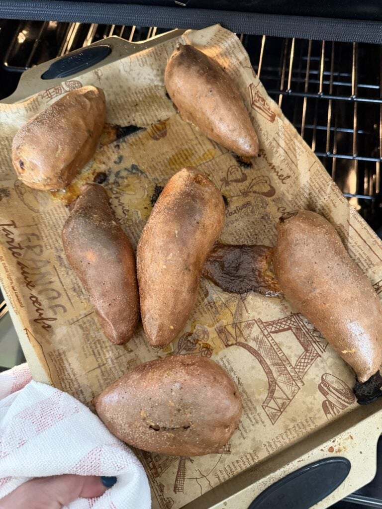 Whole oven baked sweet potatoes with crispy salted skins