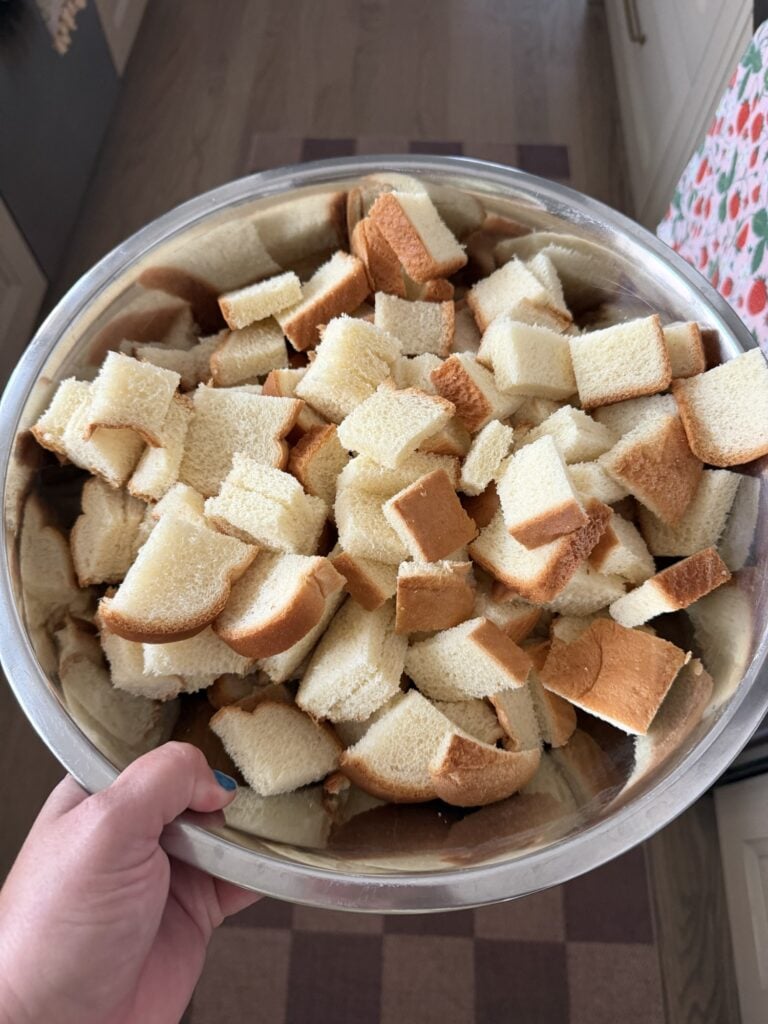 Cubed white bread dried overnight in a large bowl for homemade stuffing.