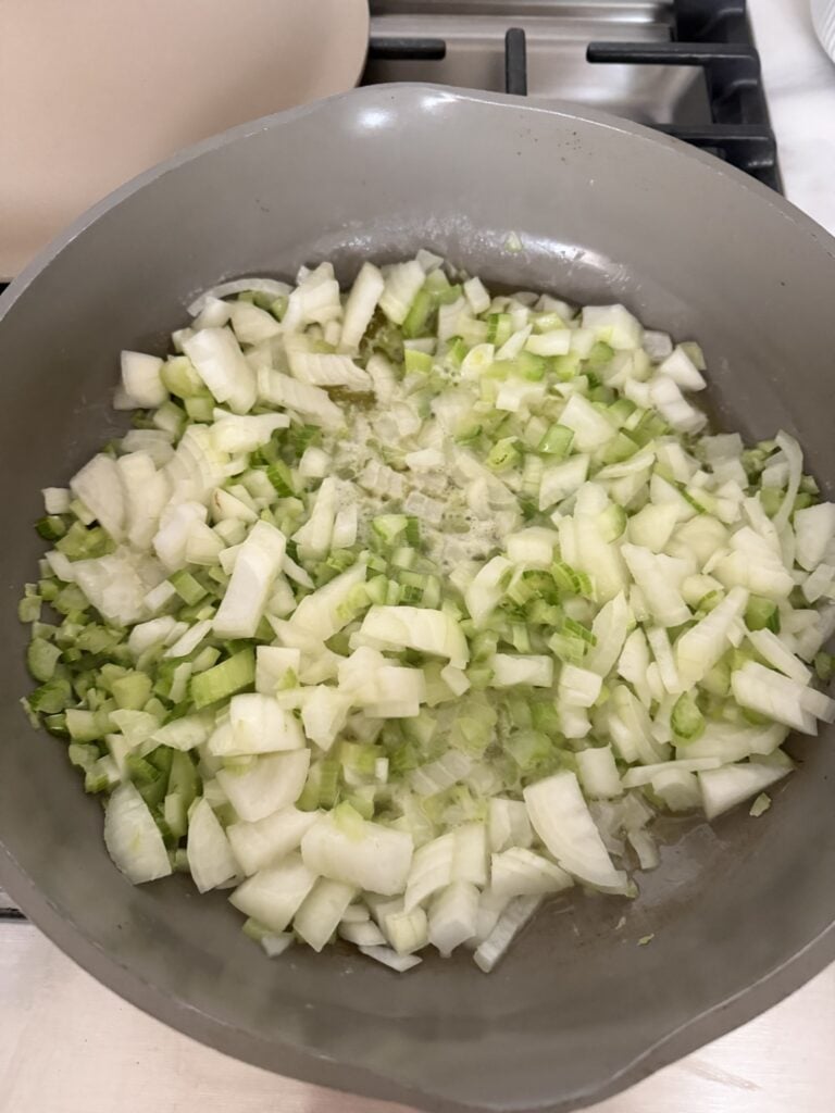 Finely diced onion and celery sautéed in butter for Thanksgiving turkey meatloaf.