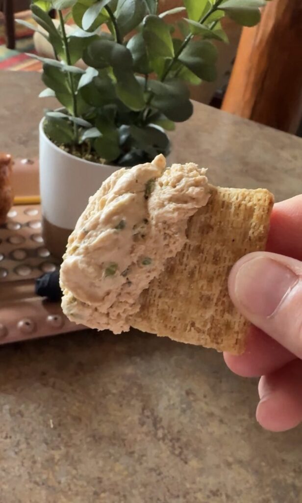 Creamy Wisconsin beef and cheddar cheese spread on a Triscuit cracker