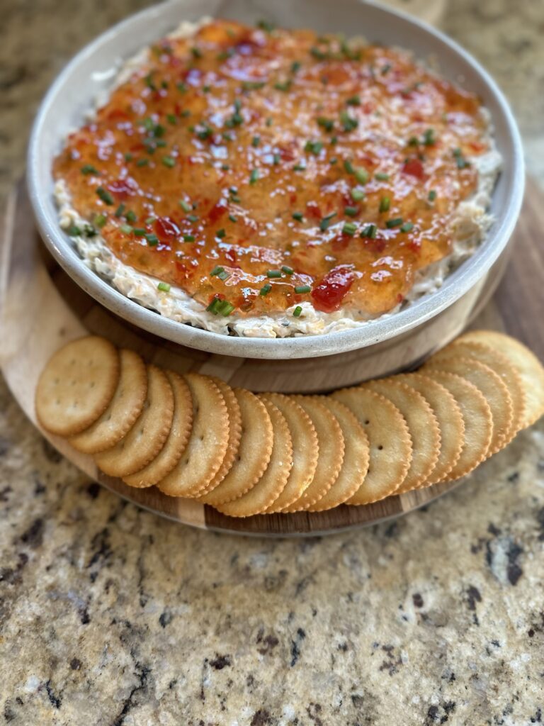 Pepper jelly cheese dip with buttery round crackers
