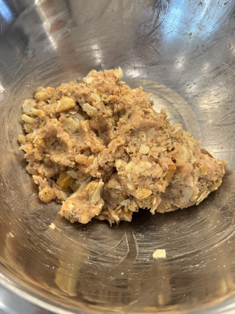 Ground chicken meatball mixture with Caesar croutons Parmesan mozzarella and seasonings