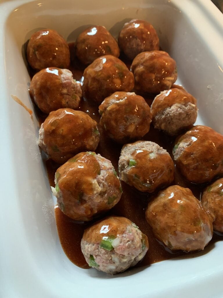 Sweet and Savory Tomato Sauce for Meatloaf Meatballs spooned on top of the meatballs