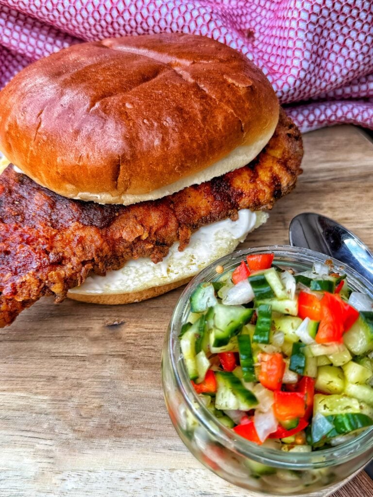 Chicago hot chicken sandwich with crispy fried chicken, cucumber red pepper relish and toasted bun