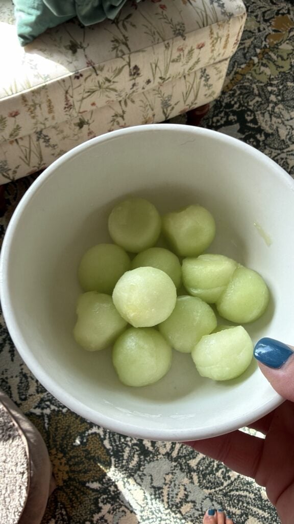 Scooped honeydew melon balls for a Honey Deuce cocktail garnish