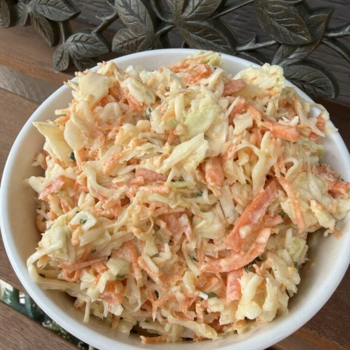 Creamy finely chopped coleslaw made with green cabbage, carrots, onion and buttermilk dressing