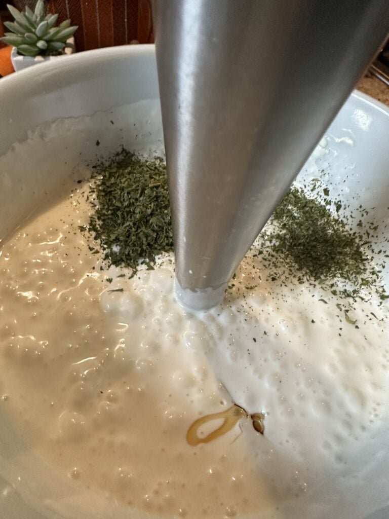 Creamy Aloha Dressing ingredients being blended smooth with an immersion blender