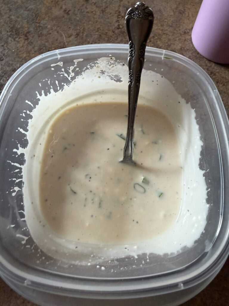 Homemade sweet and tangy creamy salad dressing stored in a container