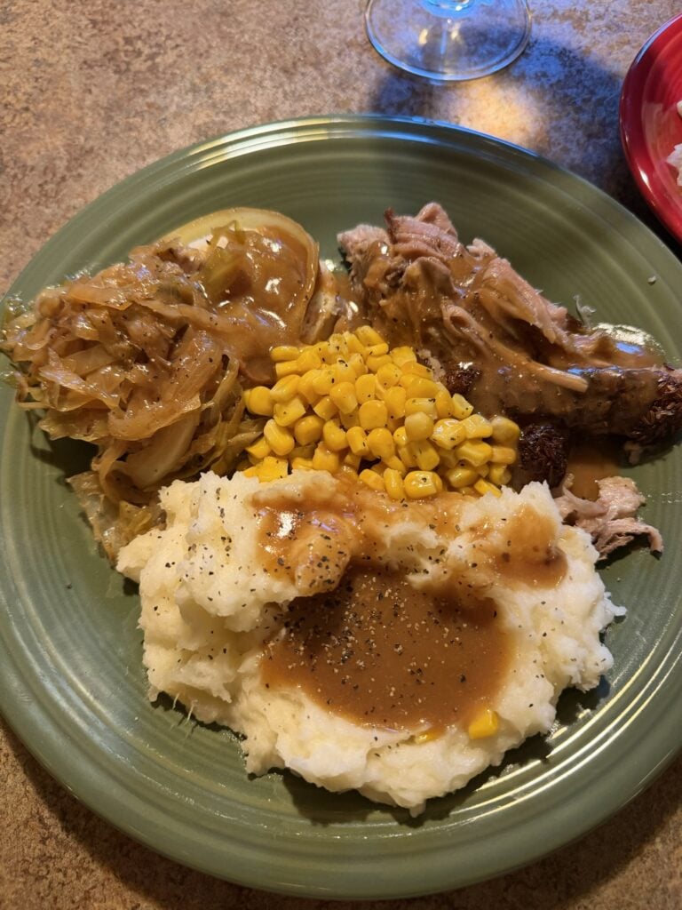 Mom’s Pork Roast served with Czech bread dumplings, sautéed cabbage and brown gravy.