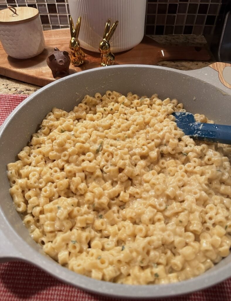 Close-up of creamy homemade Mini Mac and Cheese with ditalini pasta coated in cheddar cheese sauce.